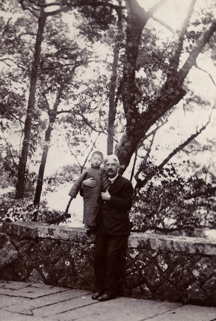 Dewey in China with child.